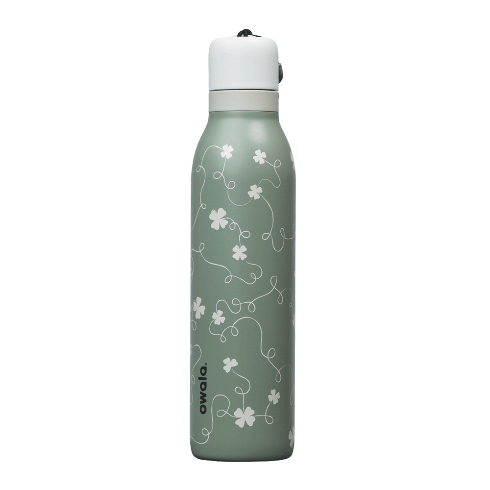 Owala RS: Clover Achiever FreeSip Twist 24oz bottle in sage green with subtle white four-leaf clover pattern; white twist-off lid; animated 360-degree spin view